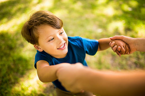 istock Boy having fun playing with parent in a park 469251776