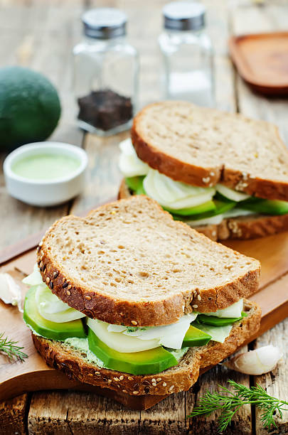 istock sandwiches with avocado, cheese, cabbage and cheese and herb topping 469252266