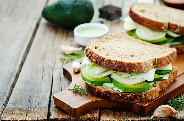 istock sandwiches with avocado, cheese, cabbage and cheese and herb topping 469252278