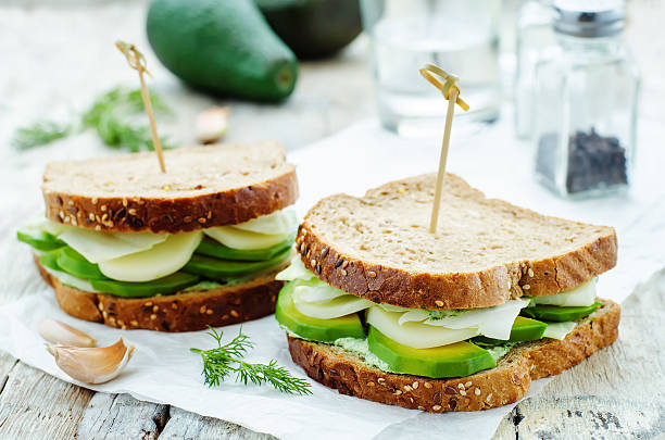 istock sandwiches with avocado, cheese, cabbage and cheese and herb topping 469252284