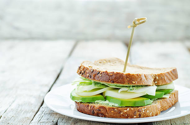 istock sandwiches with avocado, cheese, cabbage and cheese and herb topping 469252302