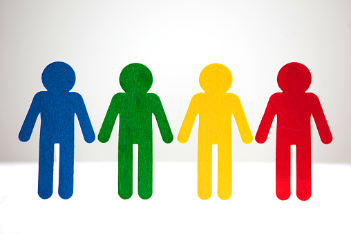 Four people of different colors lined up on a grid.