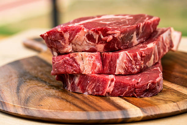 istock Fresh beef steaks on wooden board 469258464