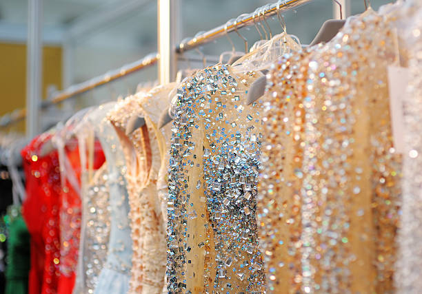 istock Beautiful wedding or evening dresses hanging on a rack 469258958