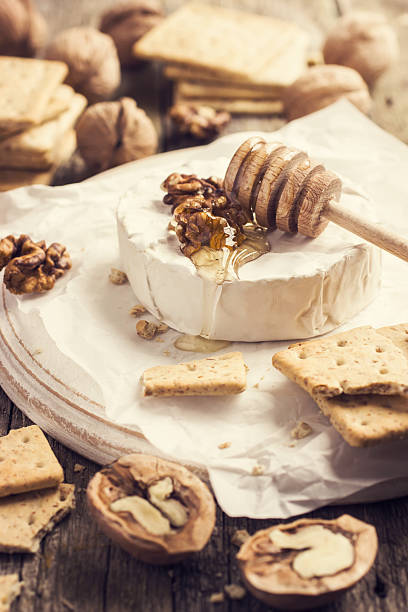 istock camembert cheese with crackers, nuts and honey 469274286