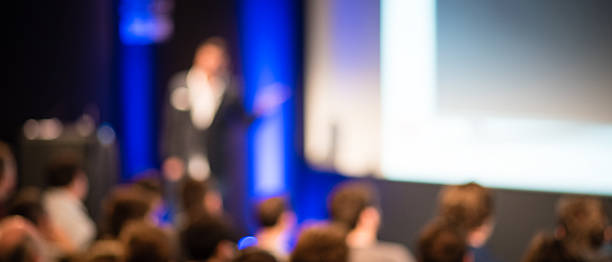 istock Large Group of People Listening to a Presentation 469274902