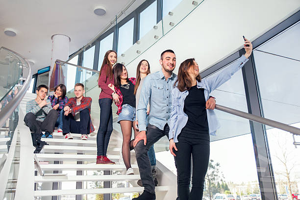 istock Group of university students make selfie on the stairs 469275074