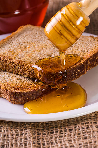 istock toast drenched with honey close-up 469276198