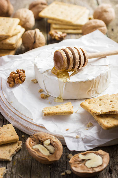 istock camembert cheese with crackers, nuts and honey 469279598