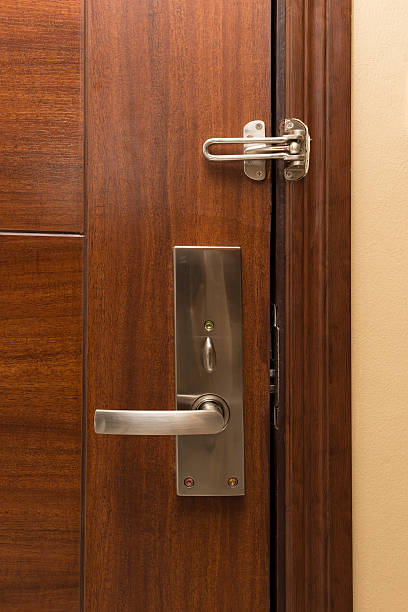 istock metal door handle on wooden door 469282902