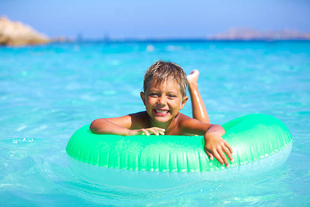 istock Boy playing in the sea 469283122