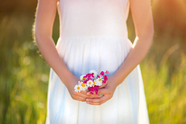 istock Woman holding flowers 469286158