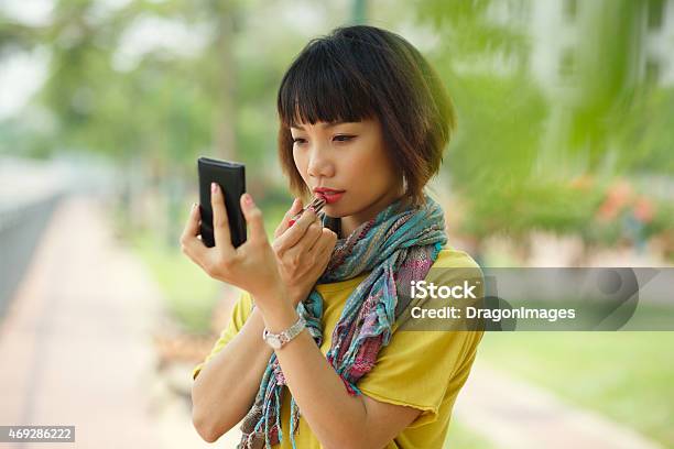 Applying Lipstick Stock Photo - Download Image Now - 20-29 Years, 2015, Adult