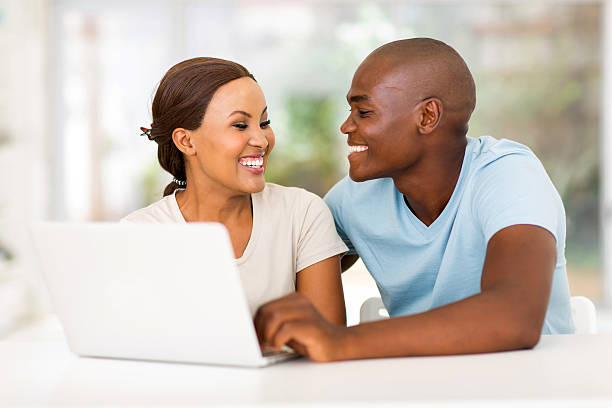 istock african american couple with laptop computer 469290688