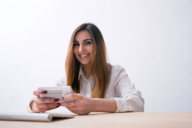 istock Smiling woman sitting on the table 469291338