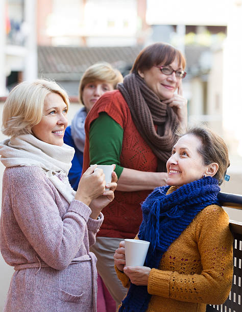 istock Senior women drinking tea at balcony 469303042