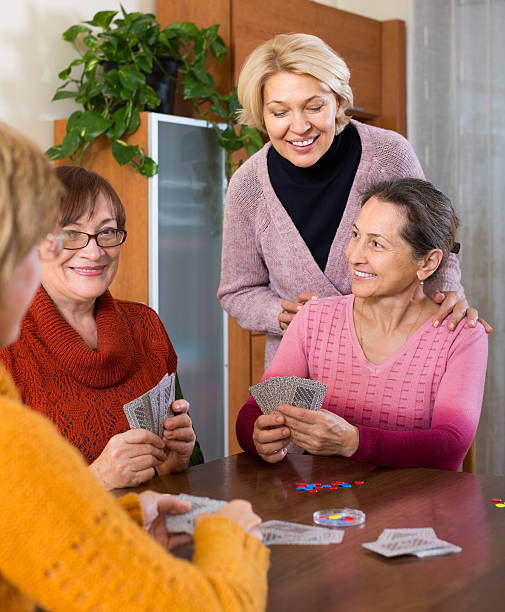 istock Female pensioners playing cards 469305174