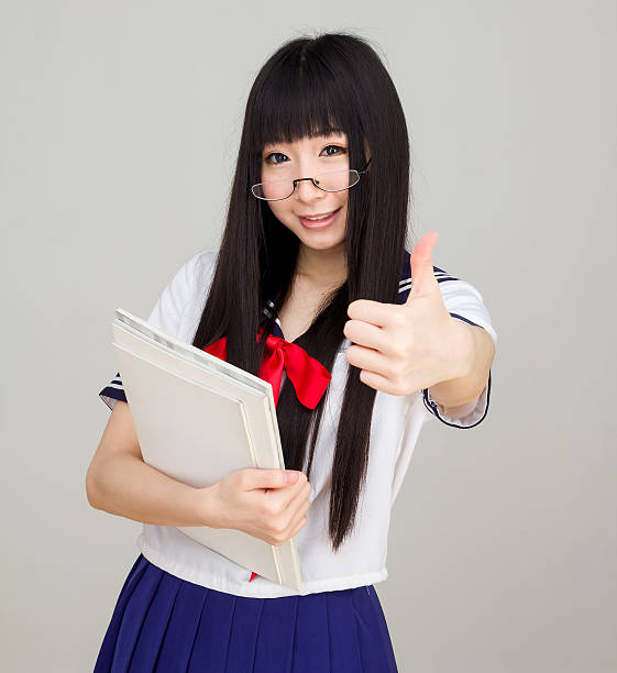 istock asian girl student in school uniform thumb up 469306530