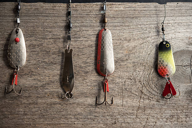 istock four old spoon lures on wooden plank 469310104