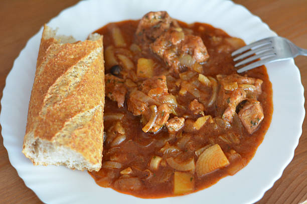 istock Traditional goulash with onion and bread 469311300