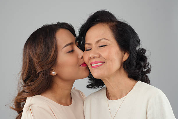 istock Kissing mother 469311372