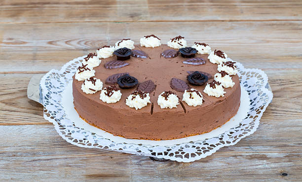 istock Chocolate cream pie on rustic wood cake top 469314652