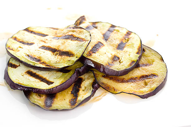 istock Some fried slices of eggplant isolated on white 469315338