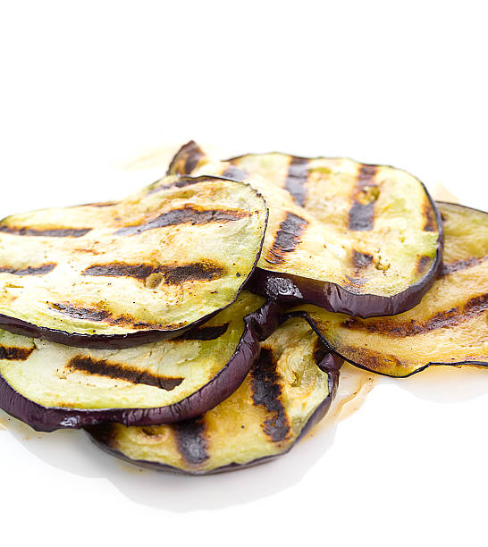 istock Some fried slices of eggplant isolated on white 469315340