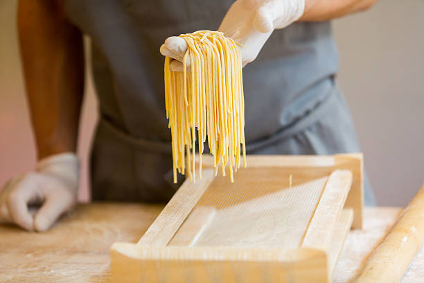 istock Chef holding homemade pasta 469315944