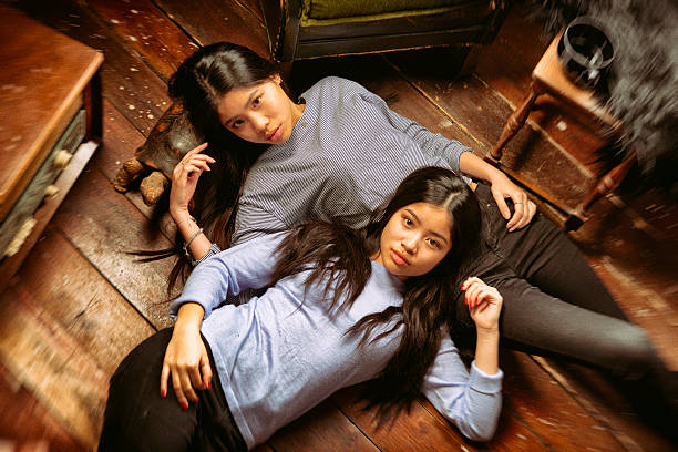 istock Sisters lying on the floor having a nice time 469316934