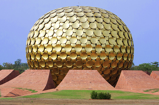 Auroville, India - April 1, 2015: Matrimandir - Golden Temple in Auroville. Matrimandir is an edifice of spiritual significance for practitioners of Integral yoga, situated at the centre of Auroville initiated by The Mother of the Sri Aurobindo Ashram