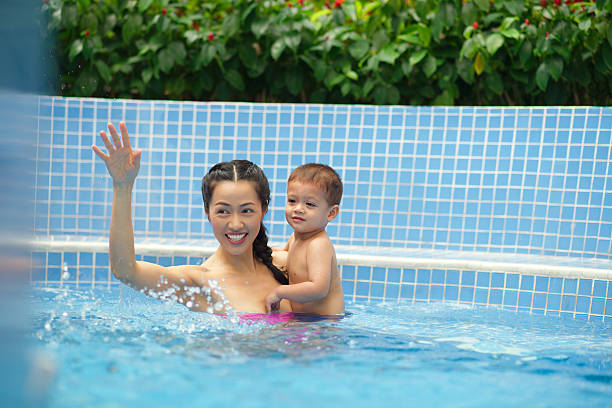 istock Family in the swimming pool 469319884