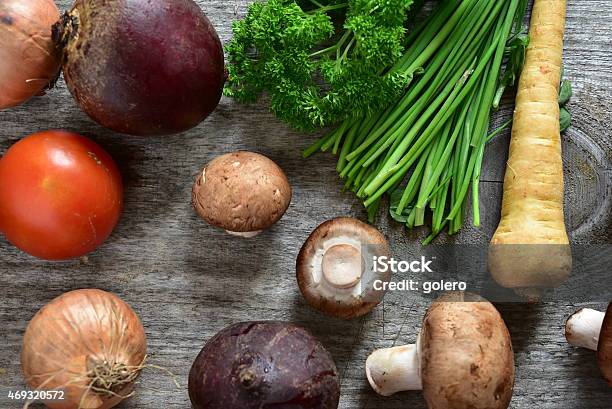 Raw Vegetables On Wooden Plank In The Kitchen Stock Photo - Download Image Now - 2015, Arrangement, Backgrounds