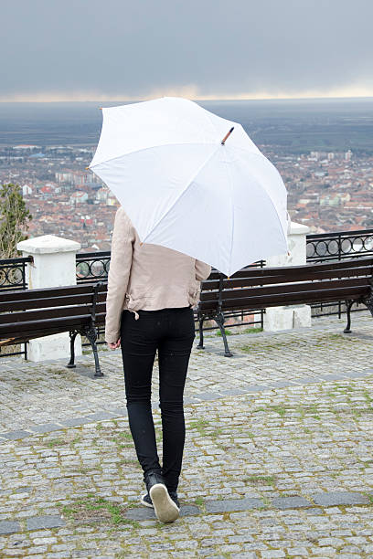 istock Girl with umbrella 469320722