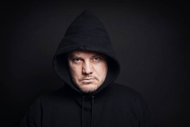 istock man wearing black hoodie 469320750