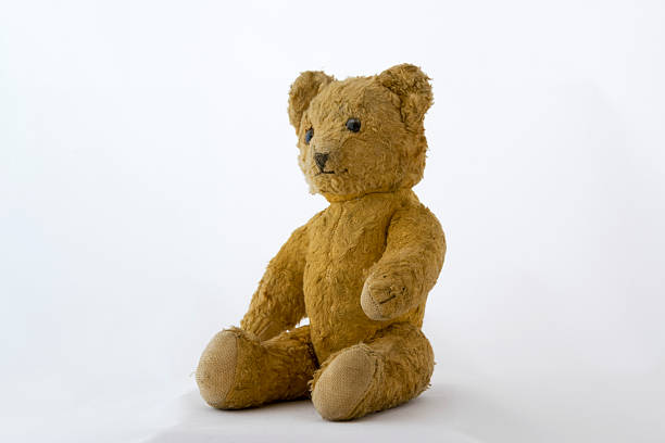 istock old teddybear sitting and looking to the left 469320974