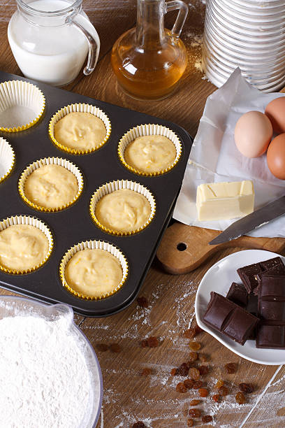 istock The process of cooking muffins with raisins vertical top view 469321426