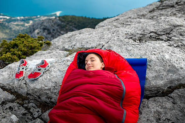 istock Woman in sleeping bag on the mountain 469322156