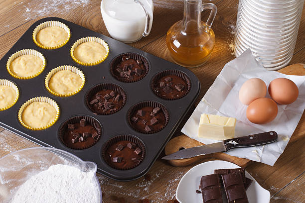 istock cooking chocolate and vanilla cupcakes top view horizontal 469322240