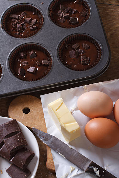 istock preparation of chocolate muffins closeup top view vertical 469323102
