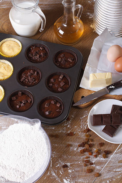 istock cooking chocolate and vanilla cupcakes close-up vertical 469323496