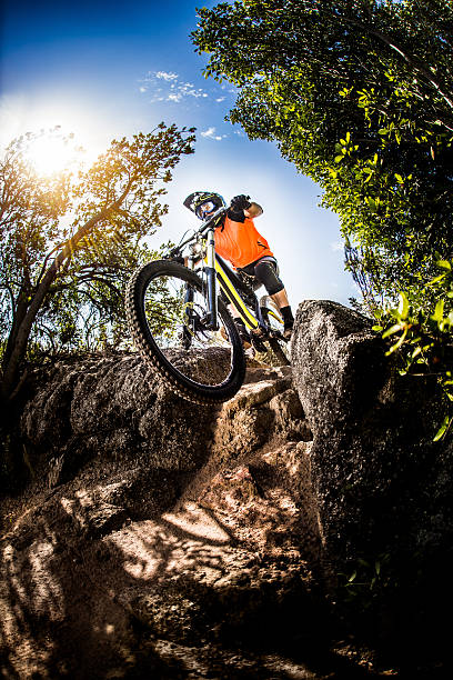 istock Adventurous mountain biker going over rocks on an off-road trail 469325706