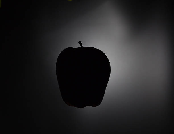 Apple silhouette on a black background