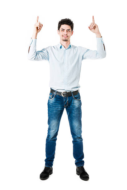 istock Young Handsome Male Pointing up to Copy Space and Smiling 469329064