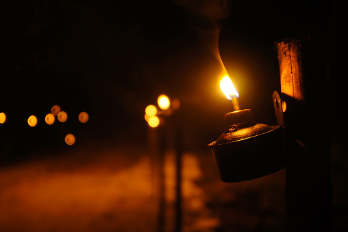 Aildilfitri Oil Lamp - Pelita in its original ambient lighting at night