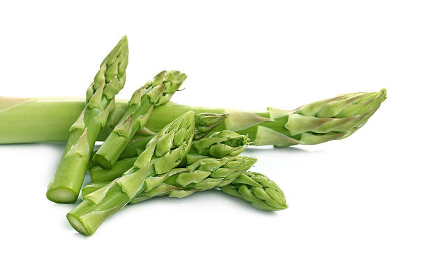 istock Bunch of fresh asparagus isolated on a white 469340276