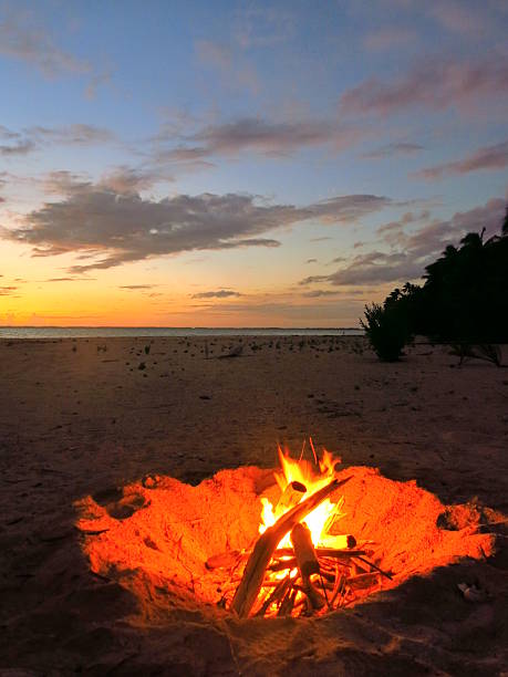 istock Beach fire at sunset in the Tuamotus, South Pacific. 469340454