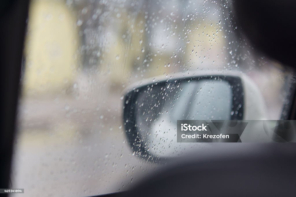 rain drops on automobile glass drops of a rain flow down on automobile glass casting grief 2015 Stock Photo