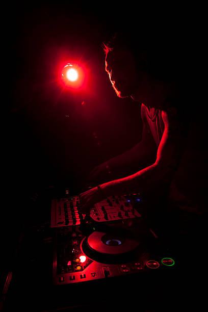 istock Disc jockey mixing music 469344154