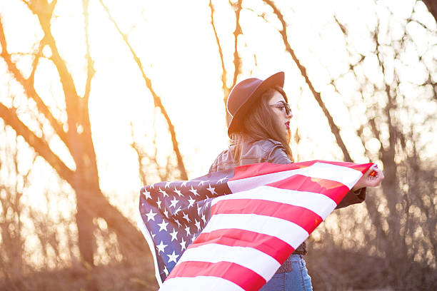 istock Girl is waving american flag 469344294